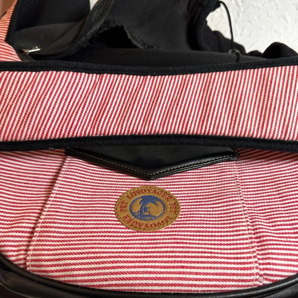 Pet carrier bag strap has a cell phone holder. The strap is padded like new.